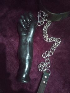 Rubber fist. lead & chain collar, purple background, County Durham BDSM dungeon