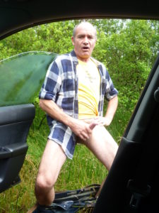 Older man masturbating by roadside