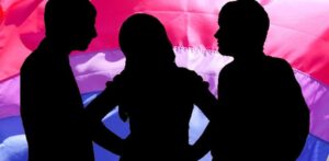 Threesome, woman with man either side, bisexual flag backdrop